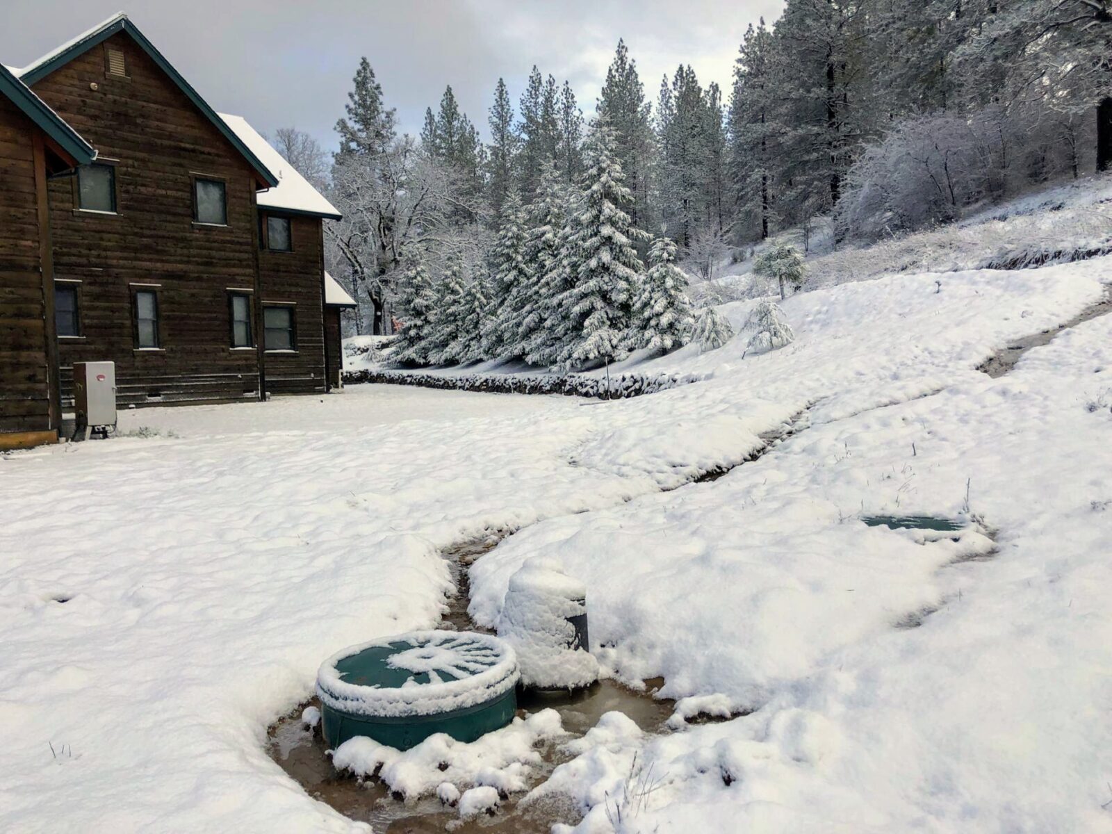 Hoot septic system installed at mountain cabin in winter Northern California